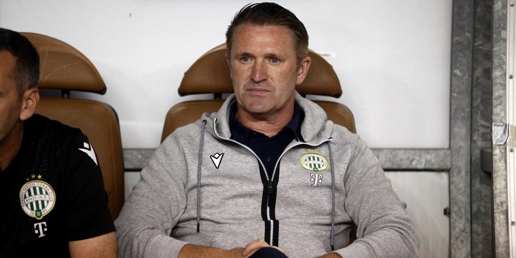 Ferencvaros manager Robbie Keane sits in the dugout