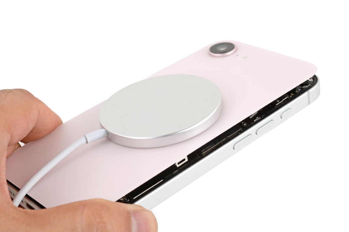 iPhone 16e with a MagSafe charger after transplanting an iPhone 17e back