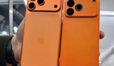 An orange iPhone 17 Pro next to an orange phone that looks like it at MWC 2026.