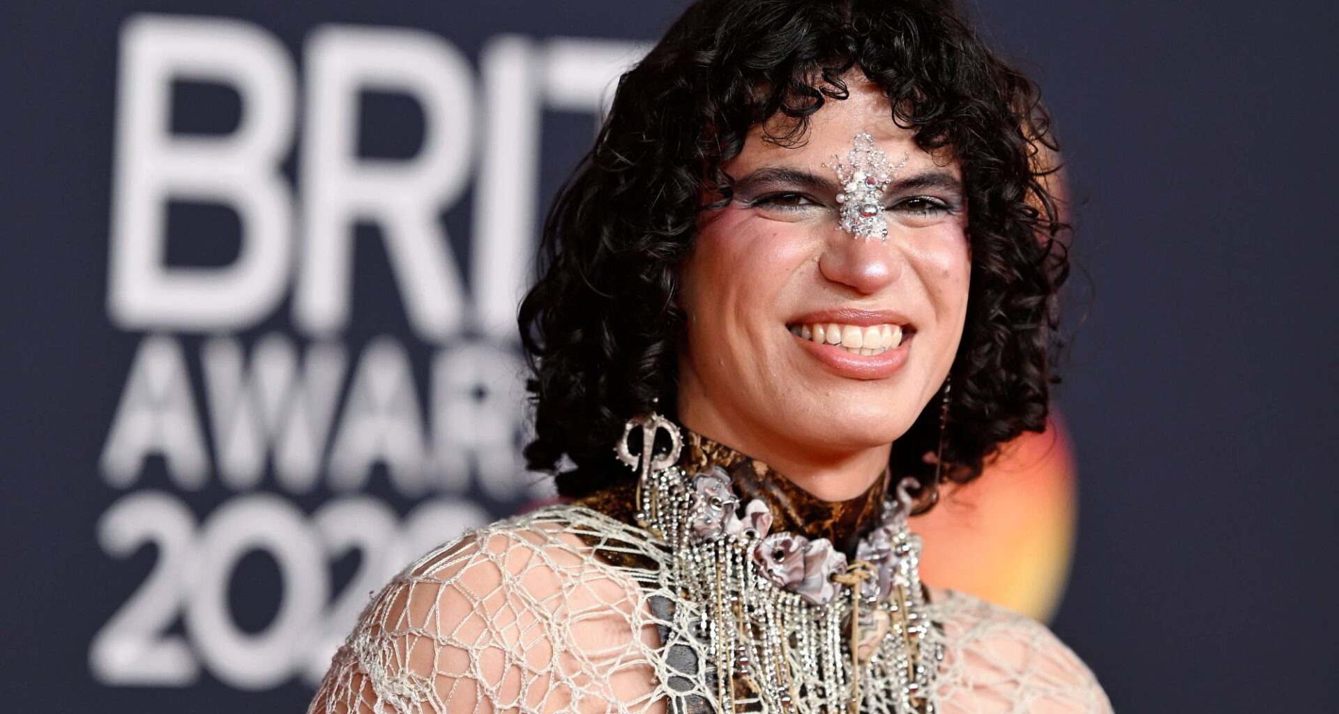 Jacob Alon raises Palestine scarf during Sharon Osbourne's speech at 2026 BRIT Awards