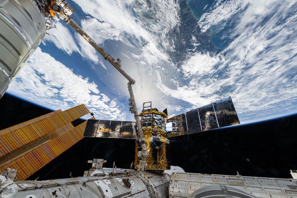 The Japanese HTV-X1 cargo spacecraft is pictured attached to the Earth-facing port on the International Space Station’s Harmony module with the Canadarm2 robotic arm in the foreground. NASA