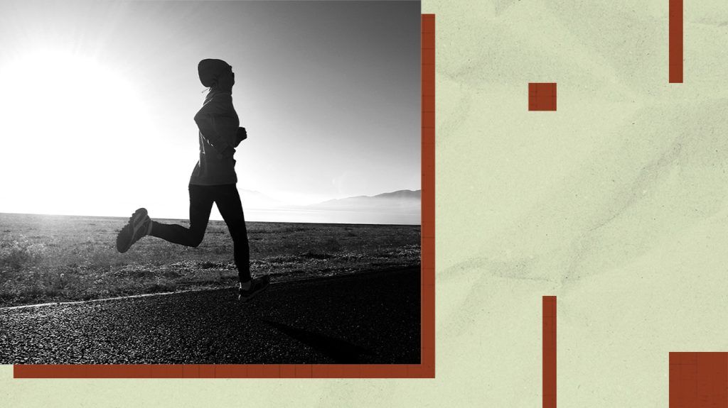 A jogger runs at sunrise