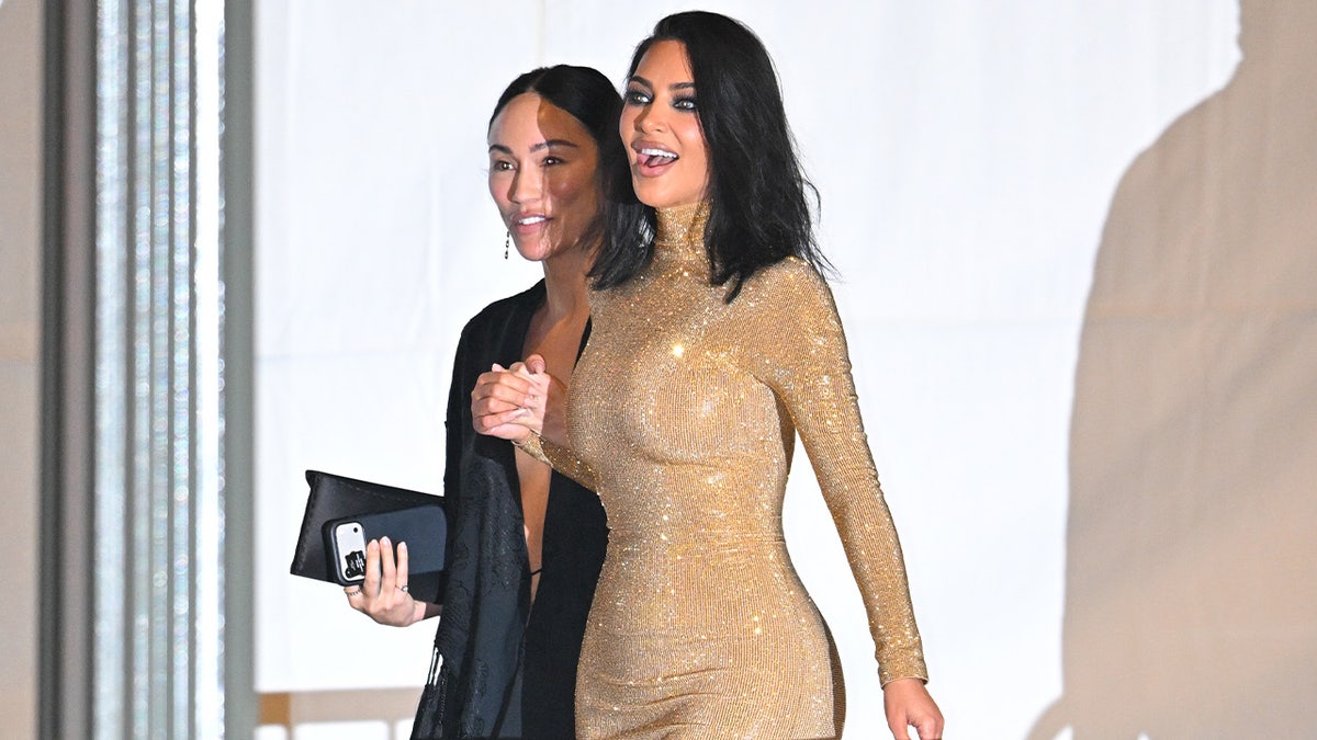 Kim Kardashian walks with Stephanie Shephard.
