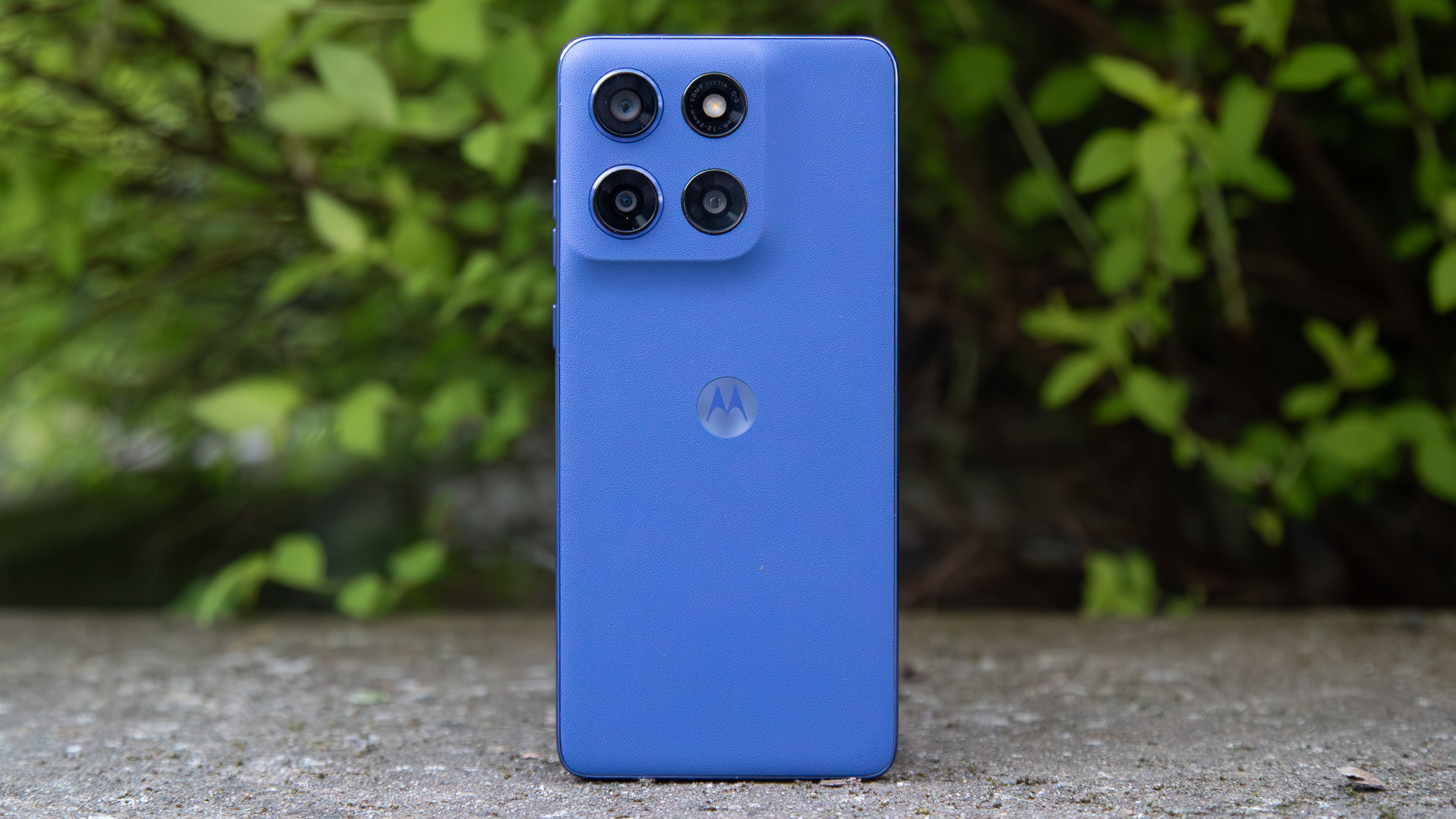 Moto G Stylus 2025 in front of a bush