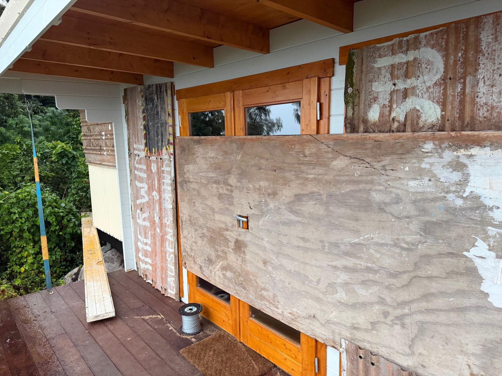 Boarded up windows and doors.