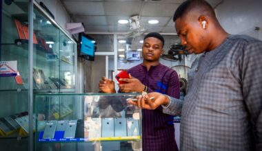 A customer browses mobile phone handsets inside a shop at the Ikeja computer village market in Lagos, Nigeria, on Monday, March 29, 2021.