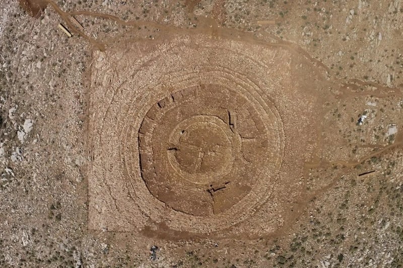 Aerial view of the Minoan labyrinth on Papoura Hill, Crete, showing concentric stone circles of Bronze Age construction.