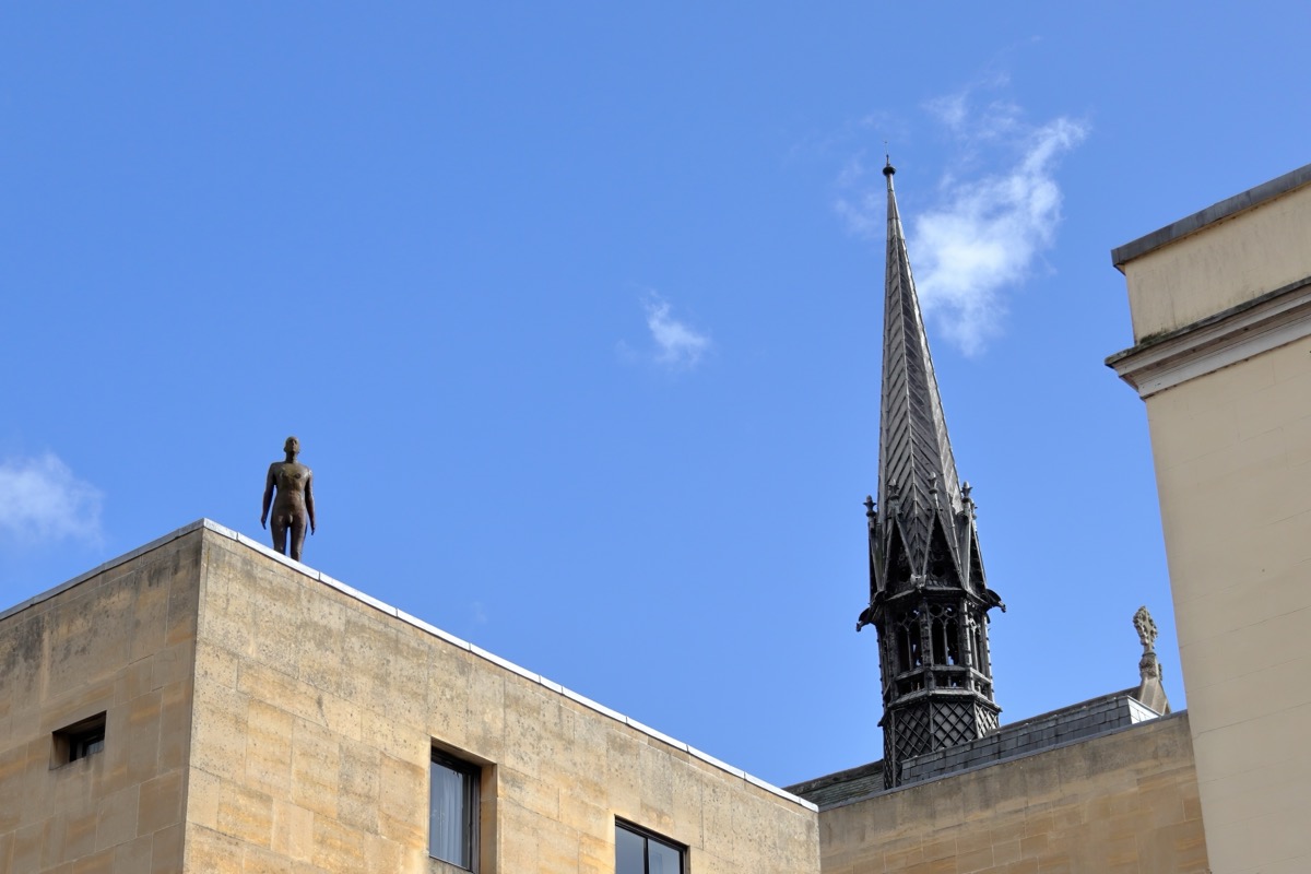 Hidden bronze figure watches Oxford's Broad Street