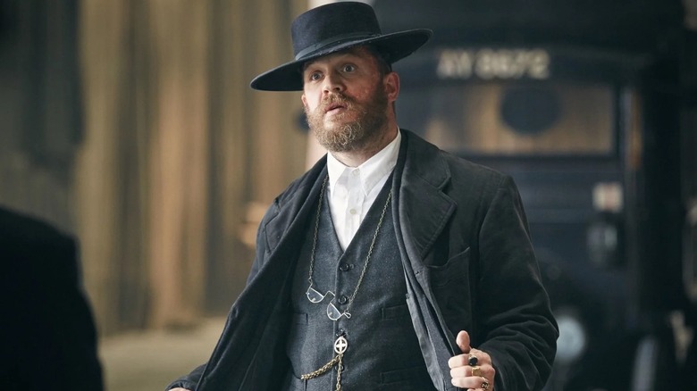 Tom Hardy as Alfie Solomons opening his coat in Peaky Blinders