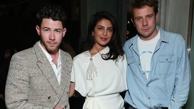 Nick Jonas and Priyanka Chopra with Dior creative director, Jonathan Anderson.