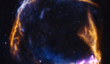 A fiery orange supernova remnant has the shame of a ring breaking apart. The outer rim is highlighted in purple at bottom right. There are stars dotting the darkness of space.