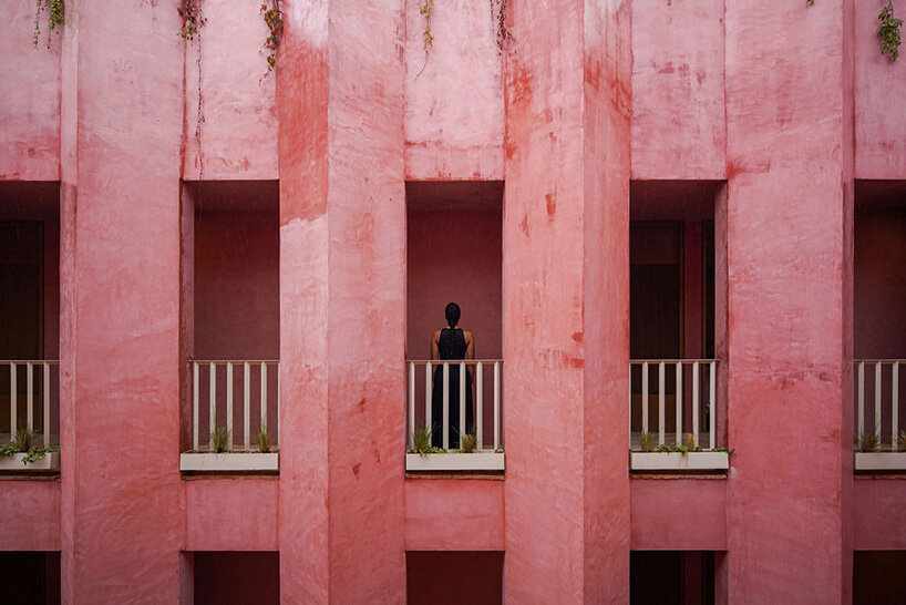 red-toned stucco surfaces form layered facade for boutique hotel by RA! in mexico - 5