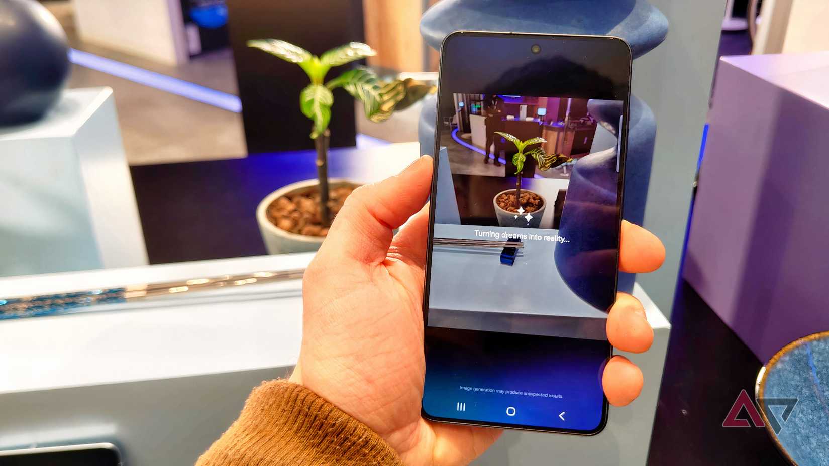 The Samsung Galaxy S26 in a man's hand, showing Generative Edit working on a photo.