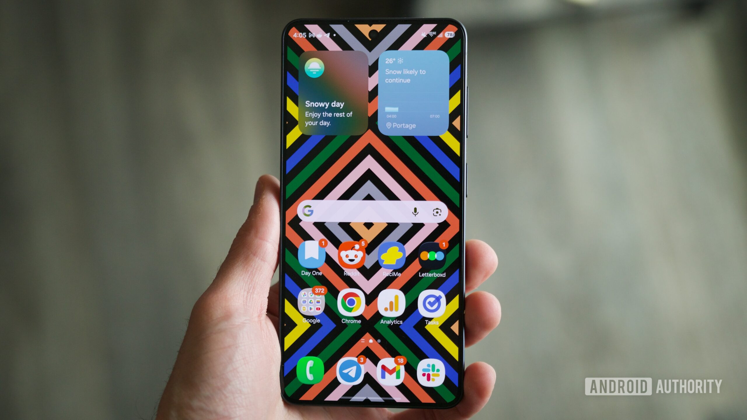 Someone holding a Samsung Galaxy S26 with its display on.