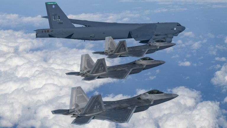 A US B-52  alongside F-22s. Pic: Reuters