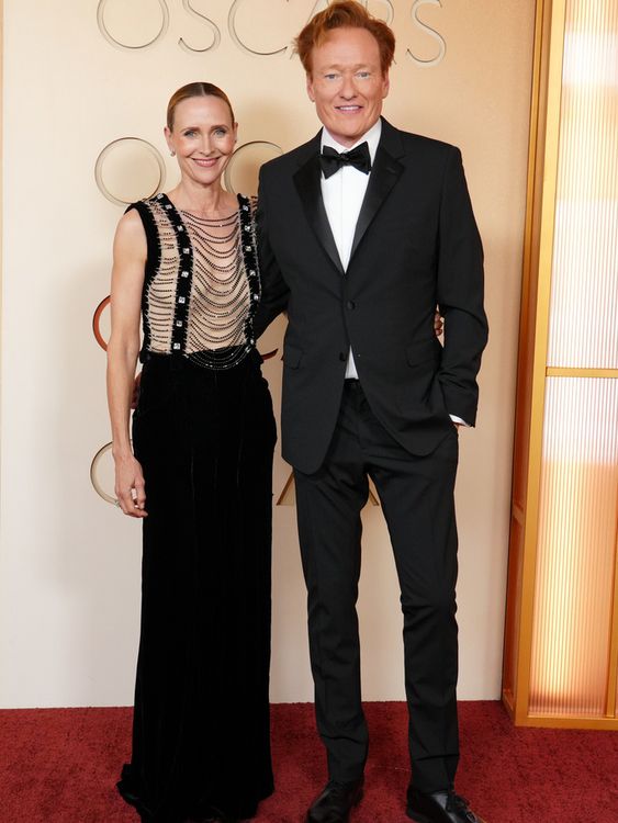 Tonight's host Conan O'Brien looking dapper with wife Liza Powel. Pic: AP