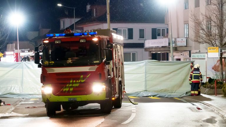 Barriers surrounding the charred remains of the vehicle. Pic: AP