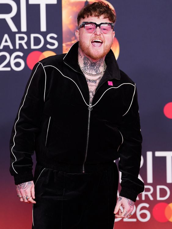 The Lottery Winners lead singer Thom Rylance brings athleisure to the red carpet in a comfy looking black trackie. Pic: PA