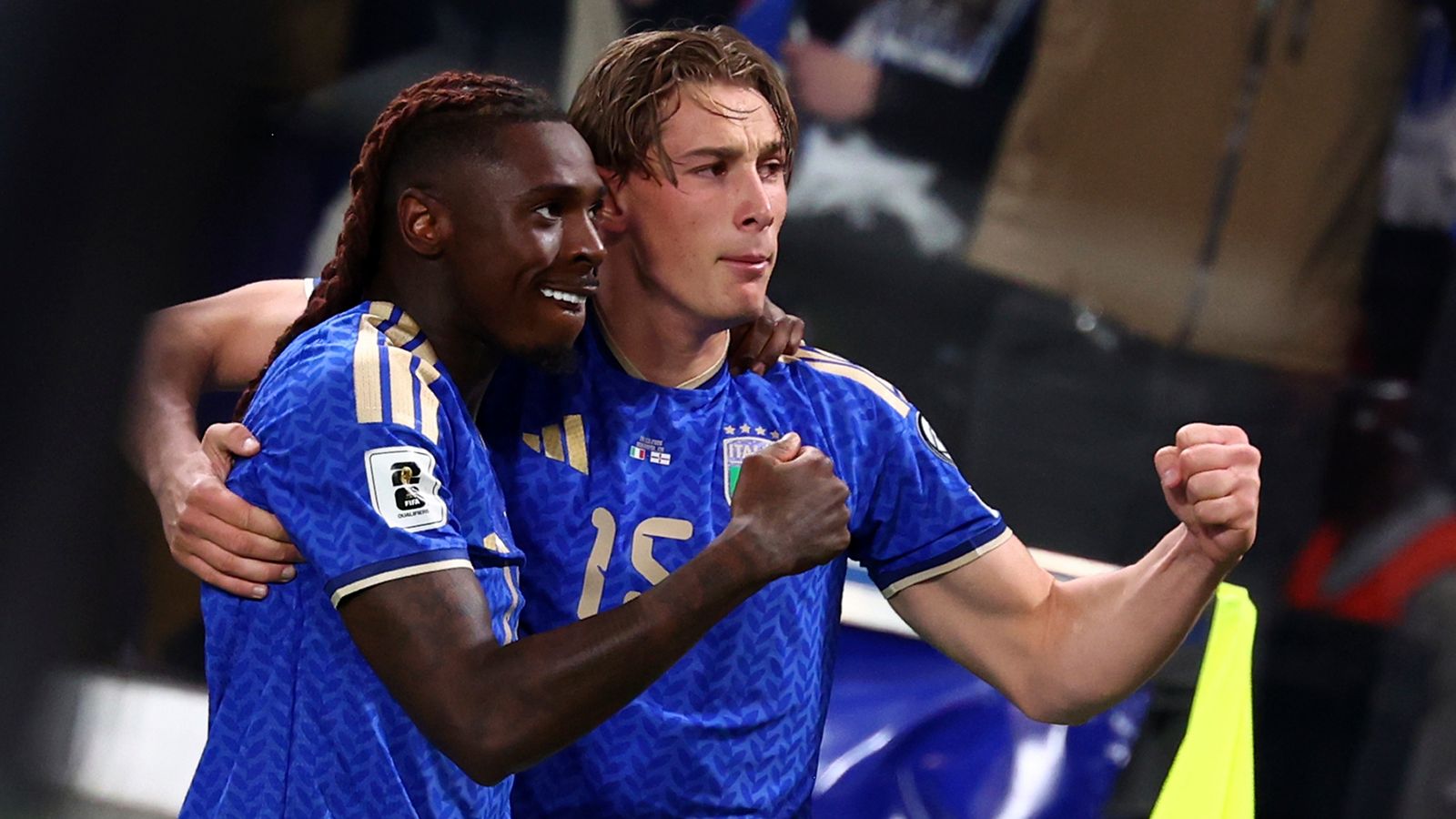Moise Kean celebrates with Pio Esposito after doubling Italy's lead