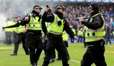 Police officers force fans back at Ibrox