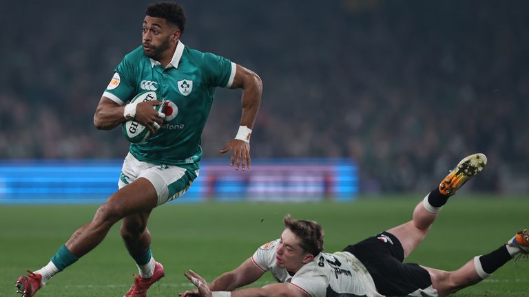 Ireland's Robert Baloucoune and Wales' Dan Edwards (right) in action during the Guinness Men's Six Nations Aviva Stadium, Dublin