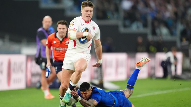 Seb Atkinson is tackled by Monty Ioane