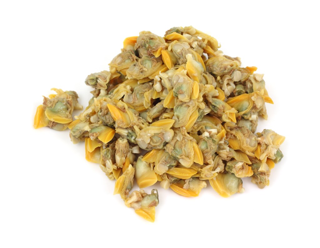 A pile of shelled, small, yellow-tan clams on a white background.