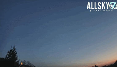 Looped video footage of a fireball meteor streaking through the evening sky