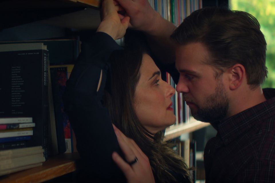 Discontented university professor M (Rachel Weisz) fantasises about having an affair with her hunky new colleague Vladimir (Leo Woodall). Photo: Netflix