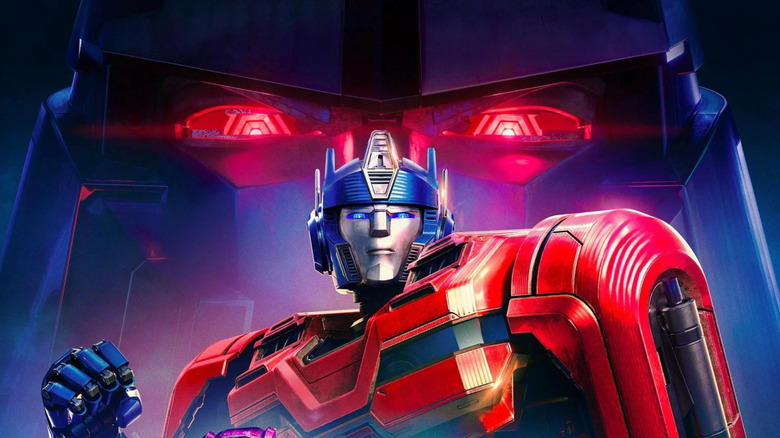 Transformers One poster: Orion Pax with Megatron's glare looming over him