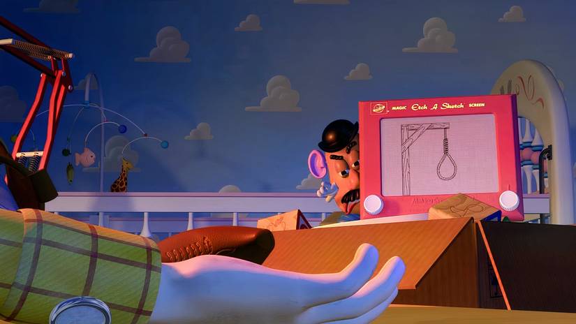 Mr. Potato threatens Woody with the Etch-A-Sketch