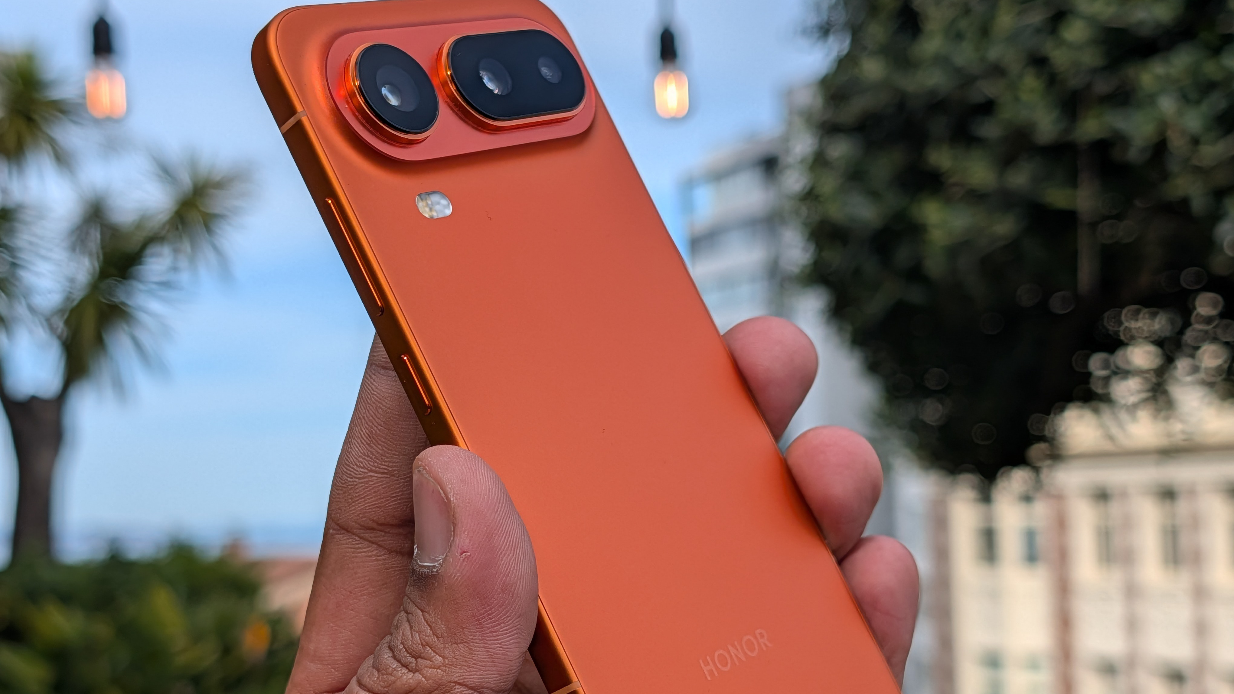 Back and camera on the Honor Magic 8 Pro Air in orange in the hand