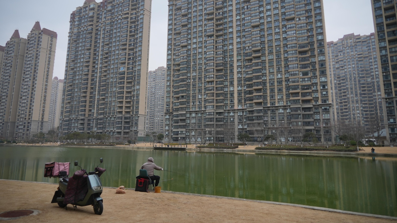 As China's economy slows, some are snapping up cheap apartments to 'retire' early