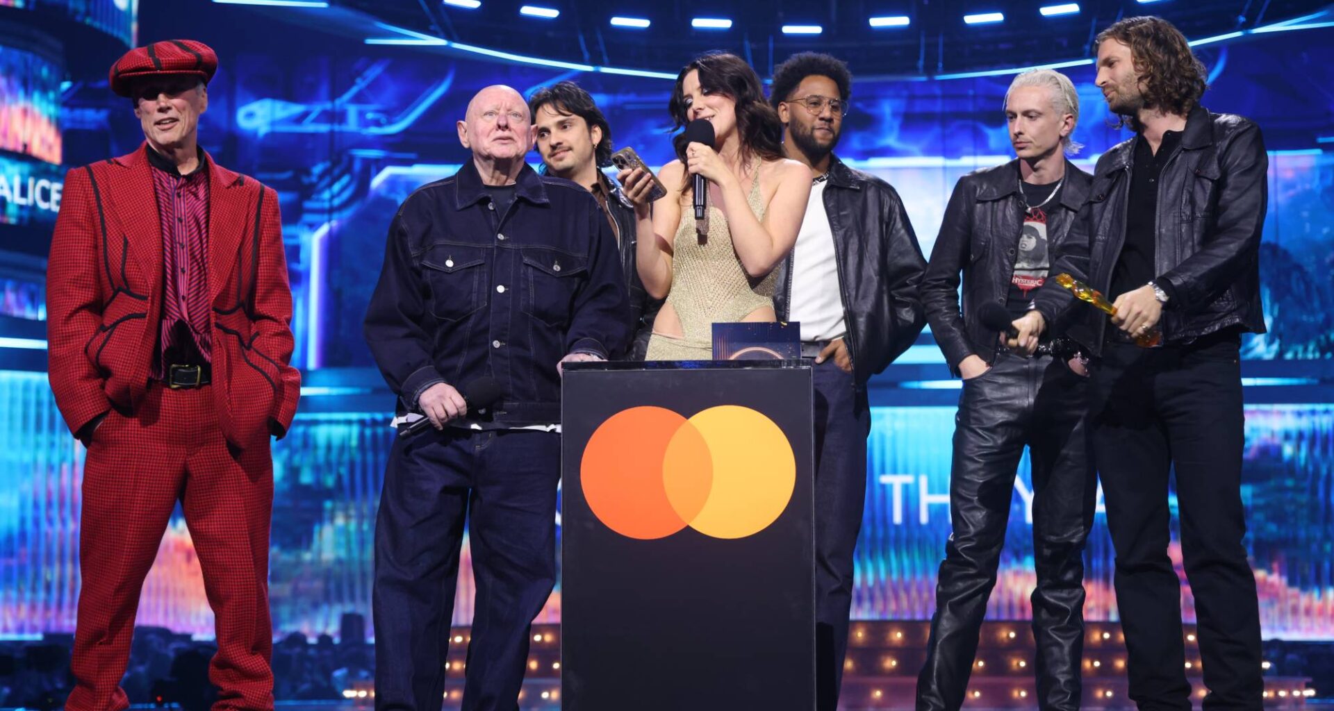 Watch Wolf Alice's Ellie Rowsell call for support for grassroots music venues in BRITs Best Group acceptance speech