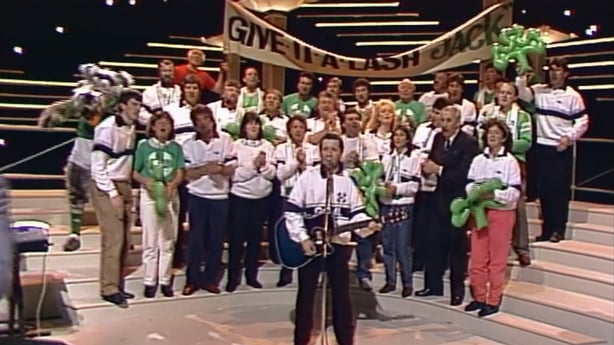 A group of sports personalities and Liam Harrison perform on the Late Late Show stage