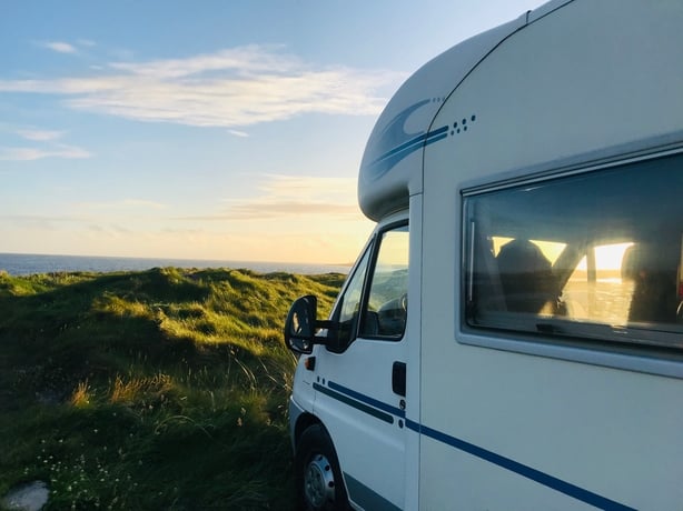 A campervan at sunset