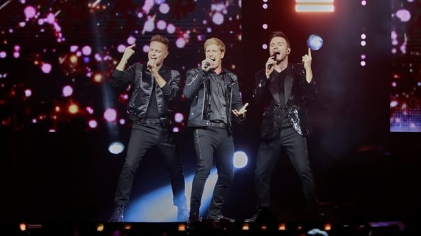 Nicky Byrne, Shane Filan and Kian Egan of Westlife performing onstage