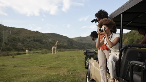 Young couple on safari vehicle