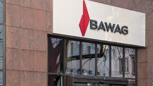 Outside of a bank branch with BAWAG signage