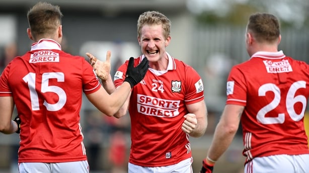 22 March 2026; Ruairi Deane of Cork celebrates with Steven Sherlock and Brian Hurley of Cork after the Allianz Football League Division 2 match between Tyrone and Cork at O'Neills Healy Park in Omagh, Tyrone. Photo by Oliver McVeigh/Sportsfile