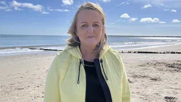 Councillor Lisa McDonald stands on Rosslare Strand.