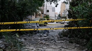 A wrecked car near damaged buildings at the site of an impact of what Bahrain's Ministry of Interior (MOI) said was falling debris of an intercepted Iranian drone last night, amid the U.S.-Israeli conflict with Iran, in Sitra, Bahrain, April 4, 2026. REUT