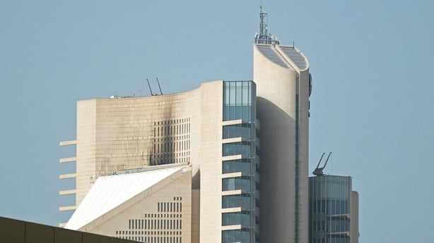 This photograph shows the impact of a fire caused by a drone attack on a building of the Kuwait Petroleum Corporation (KPC), in Kuwait City on April 5, 2026. Attacks by Iranian drones on April 5 resulted in "severe" damage to Kuwaiti oil and petrochemical facilities, the country's state petroleum co