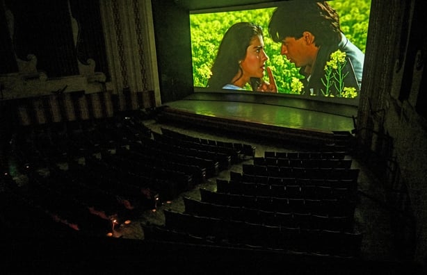 An iconic scene is seen during the screening of the popular Bollywood Hindi film Dilwale Dulhania Le Jayenge (The Brave-hearted Will Take the Bride Away) at Maratha Mandir theatre in Mumbai, on 17 October, 2025. (Photo by Indranil MUKHERJEE / AFP)