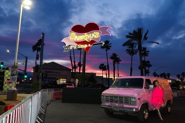 Social media influencers take photos and video at the Sabrina Carpenter Pit Stop on 9 April, 2026 in Indio, California. (Photo by VALERIE MACON / AFP)