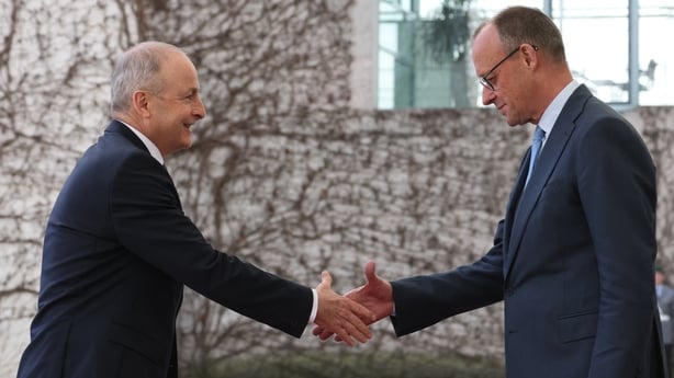 German Chancellor Friedrich Merz (R) welcomes Ireland's Prime Minister Micheal Martin at the Chancellery in Berlin on April 16, 2026. (Photo by Odd ANDERSEN / AFP)