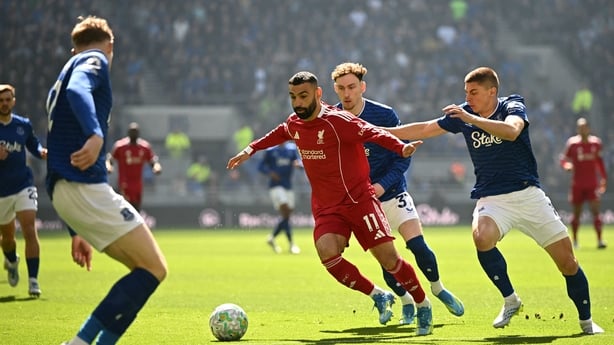 Liverpool's Egyptian striker #11 Mohamed Salah (C) vies with Everton's Ukrainian defender #16 Vitaliy Mykolenko (R) and Everton's English midfielder #37 James Garner (2R) during the English Premier League football match between Everton and Liverpool at Hill Dickinson Stadium in Liverpool, north west