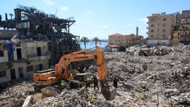 A digger removes the rubble of buildings destroyed in Israeli strikes, as the search for survivors buried underneath continues in the southern Lebanese coastal city of Tyre on April 21, 2026. Israeli defence minister said on April 21 that his country's campaign in Lebanon relied on both military and