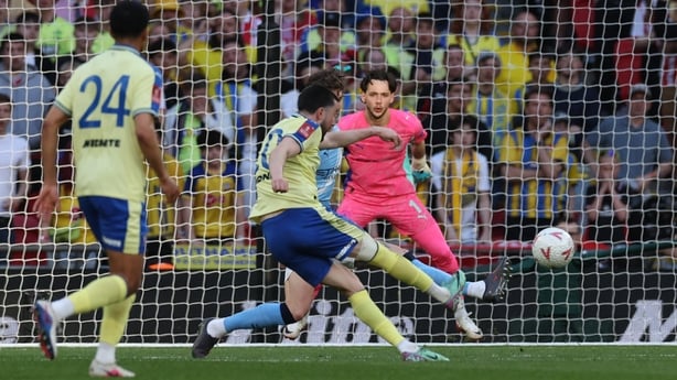 Southampton's Irish midfielder #10 Finn Azaz (C) shoots to score the opening goal of the English FA Cup semi final football match between Manchester City and Southampton at Wembley stadium in London, on April 25, 2026.