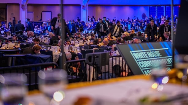 WASHINGTON, DC - APRIL 25: Secret Service agents move across the ballroom during a shooting incident at the annual White House Correspondents Association Dinner at the Washington Hilton on April 25, 2026 in Washington, DC. According to reports, President Donald Trump, along with other government off